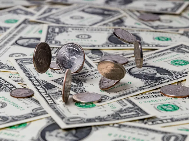 coins on pile of cash
